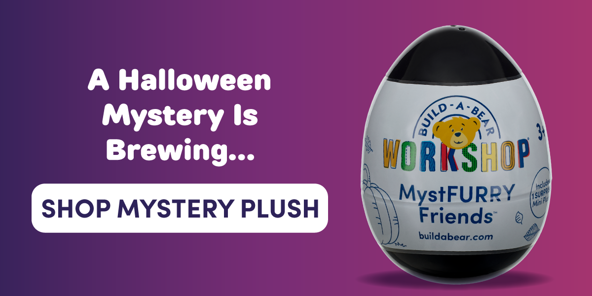 A Halloween-themed graphic with a purple gradient background. On the left, white text reads A Halloween Mystery Is Brewing... above a white button-style banner that reads SHOP MYSTERY PLUSH. On the right is a Build-A-Bear Workshop MystFURRY Friends surprise mini plush capsule shaped like a large egg with a black top and bottom. The capsule features the Build-A-Bear Workshop logo, MystFURRY Friends branding and a badge noting it includes 1 surprise mini plush. The graphic promotes a mystery Halloween plush experience.